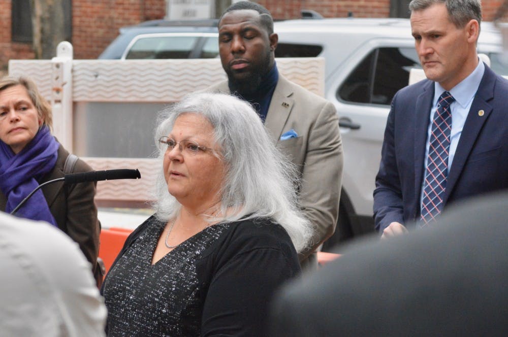 <p>Susan Bro, Heather Heyer's mother, spoke at the dedication ceremony Wednesday morning. Charlottesville City Councilor Kathy Galvin, Vice Mayor Wes Bellamy and Mayor Mike Signer are pictured behind her from left to right.&nbsp;</p>
