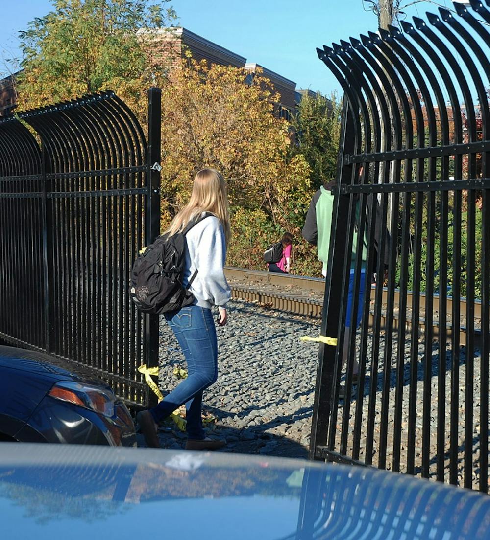 <p>Students continue to cross the train tracks where the new fence has been broken, despite police handing out tickets and court summons.</p>