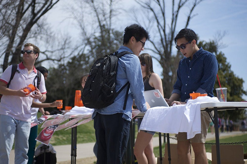 	Student Council representatives set up a table on the Lawn yesterday (above) to urge students to voice their concerns.