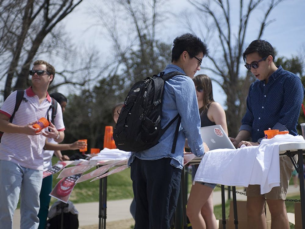 	Student Council representatives set up a table on the Lawn yesterday (above) to urge students to voice their concerns.
