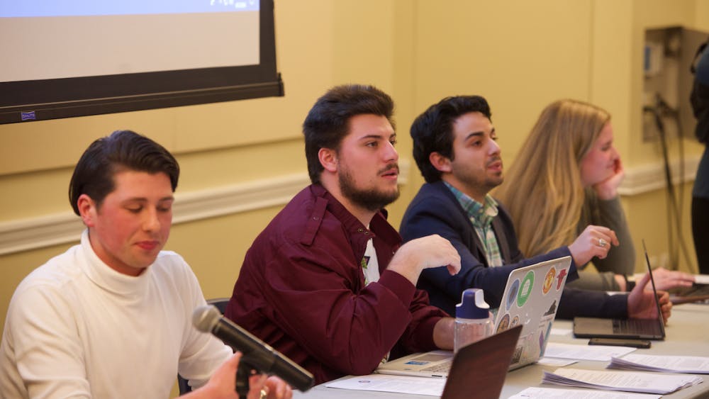 Members of the current Executive Board for Student Council, presiding over a meeting. 