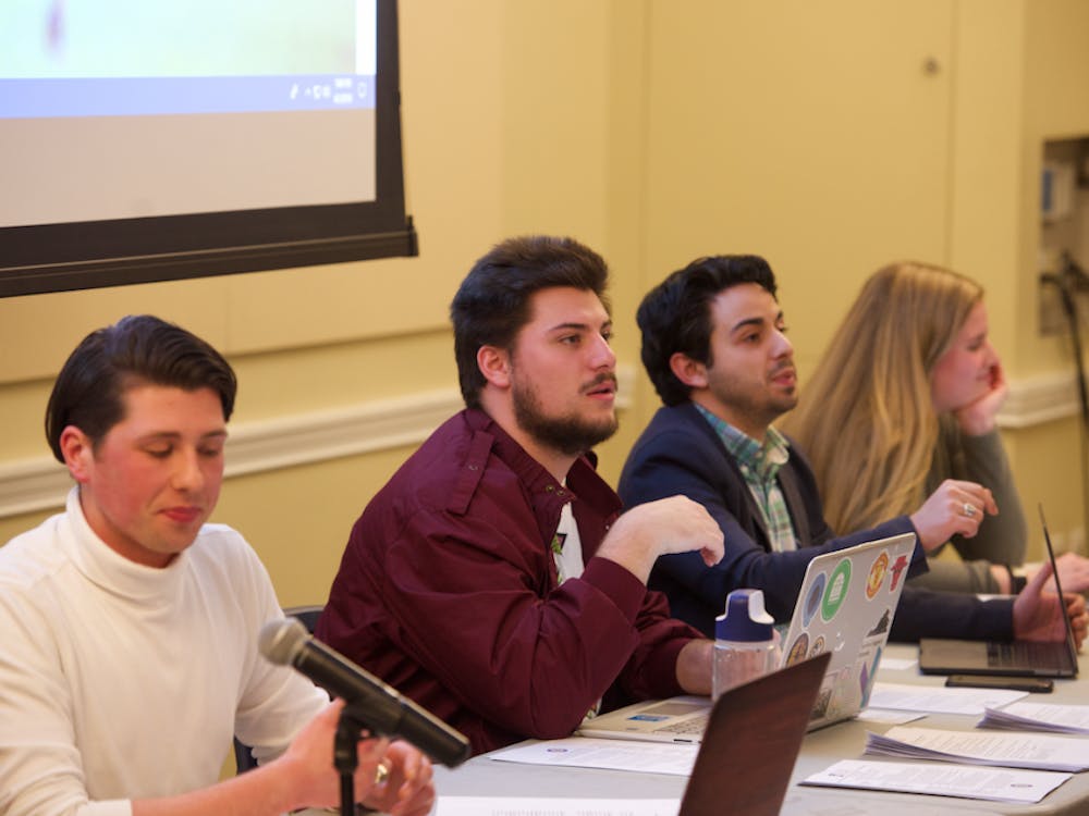 Members of the current Executive Board for Student Council, presiding over a meeting. 