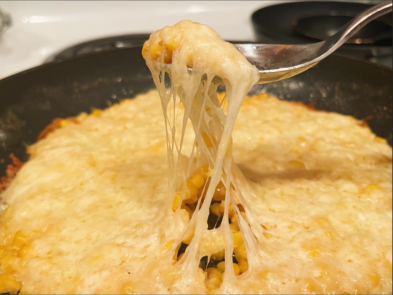 Break open your favorite crackers or chips — my go to are Ritz crackers or tortilla chips — and dig into your corn cheese.