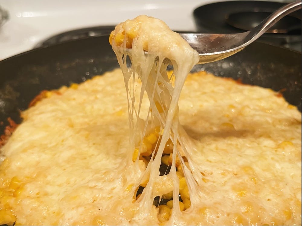 Break open your favorite crackers or chips — my go to are Ritz crackers or tortilla chips — and dig into your corn cheese.