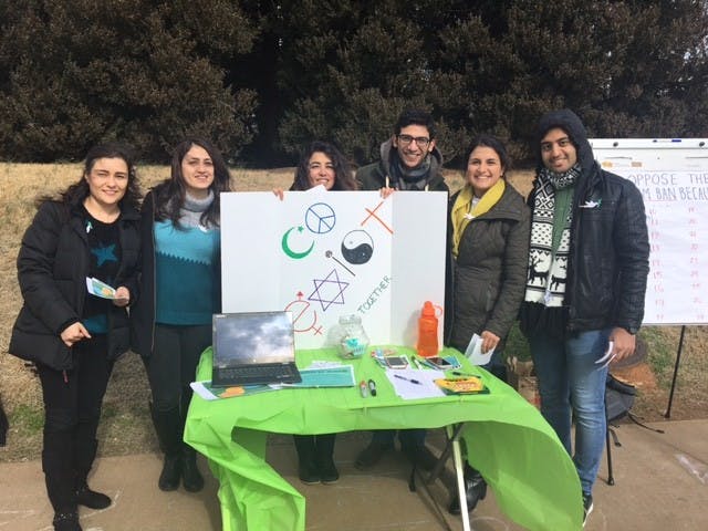 Students from the Persian Cultural Society and Iranian Student Association tabling to raise awareness for green card, visa holders impacted by Trump's latest immigration order.