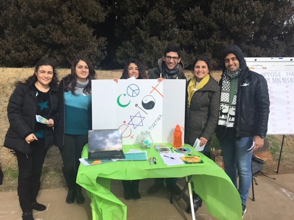 Students from the Persian Cultural Society and Iranian Student Association tabling to raise awareness for green card, visa holders impacted by Trump's latest immigration order.