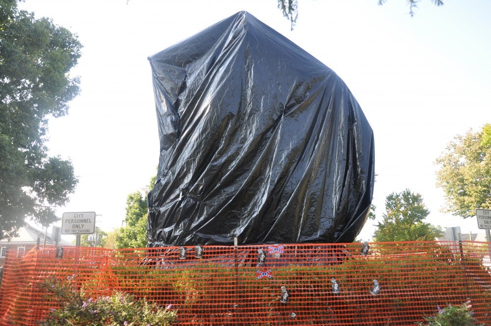 <p>The council approved the placement of the black shrouds over the statues on Aug. 22.</p>