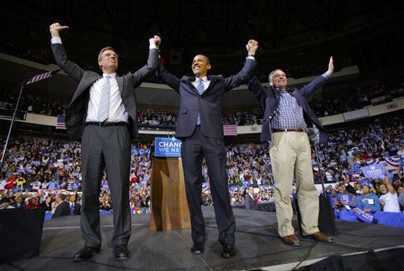 Democratic presidential candidate, Sen. Barack Obama, D-Ill., center, is joined by Virginia Democratic Senatorial candidate Mark Warner, left, and Virginia Gov. Tim Kaine, at a rally in Richmond, Va., Wednesday, Oct. 22, 2008. (AP Photo/Jae C. Hong)