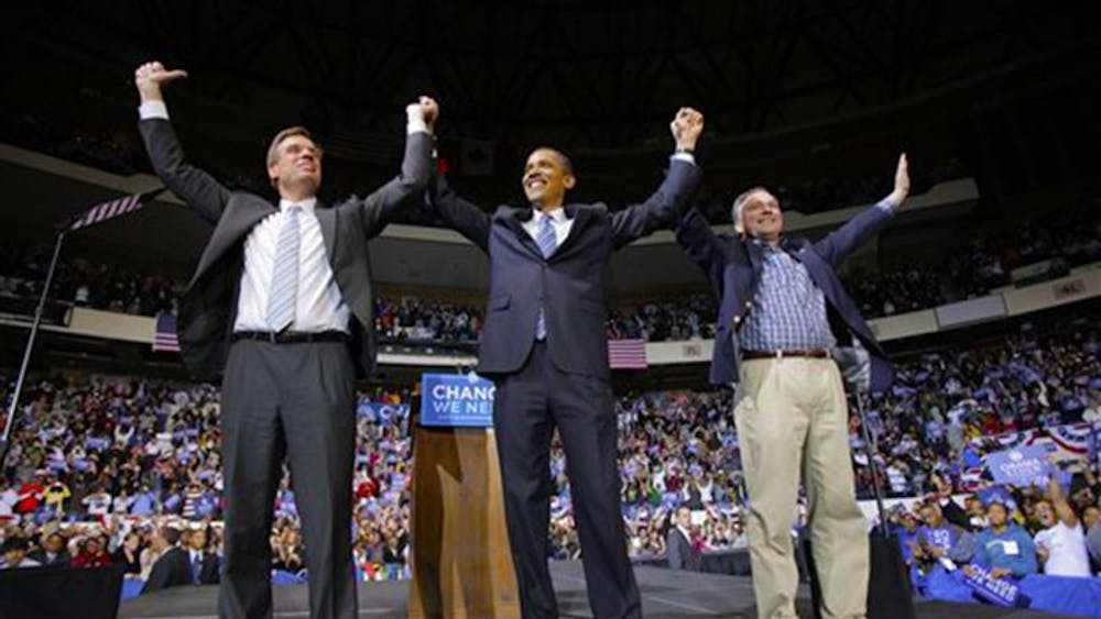 Democratic presidential candidate, Sen. Barack Obama, D-Ill., center, is joined by Virginia Democratic Senatorial candidate Mark Warner, left, and Virginia Gov. Tim Kaine, at a rally in Richmond, Va., Wednesday, Oct. 22, 2008. (AP Photo/Jae C. Hong)