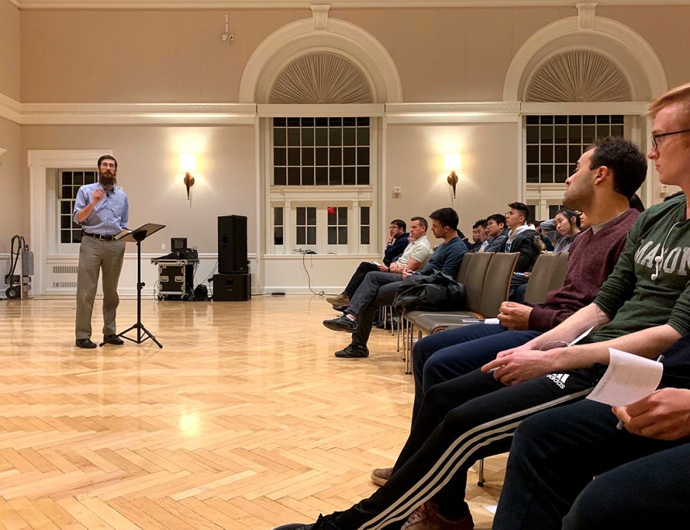 Speaker Nathan Rittenhouse addresses the question "Is Happiness Sustainable?" at the Newcomb Ballroom Feb. 20.