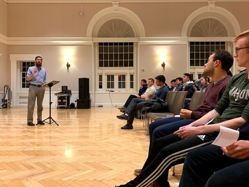 Speaker Nathan Rittenhouse addresses the question "Is Happiness Sustainable?" at the Newcomb Ballroom Feb. 20.