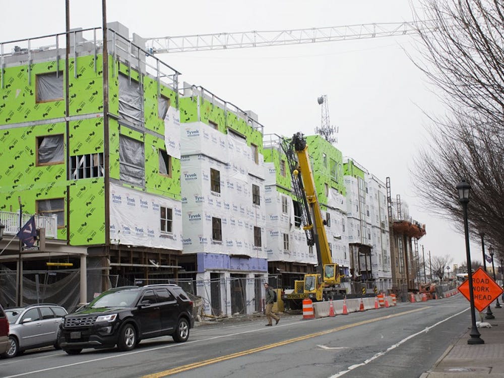 Construction of The Standard apartment building, advertised as premiere student housing, is underway on West Main Street.
