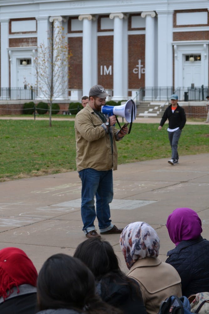A student sharing his experience during the Flash Slam, the Eliminate the Hate campaign's first event.
