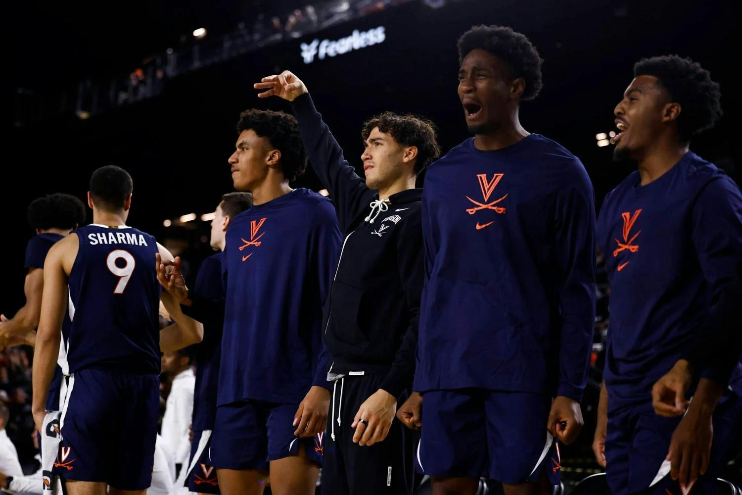Bliss, center, in black, celebrates after a play during Virginia's game against Villanova.