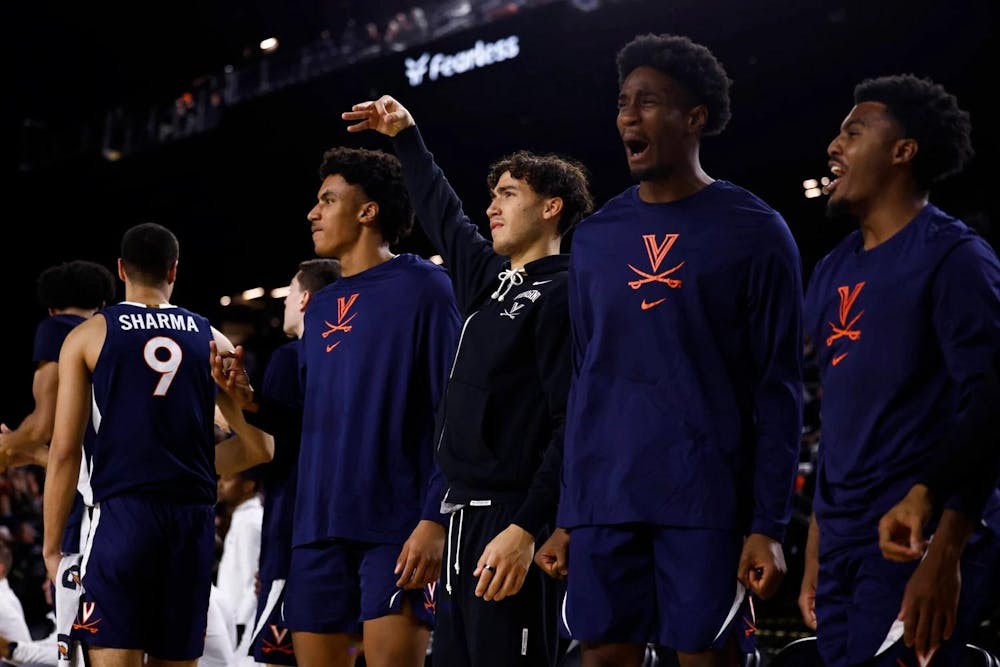 <p>Bliss, center, in black, celebrates after a play during Virginia's game against Villanova.</p>