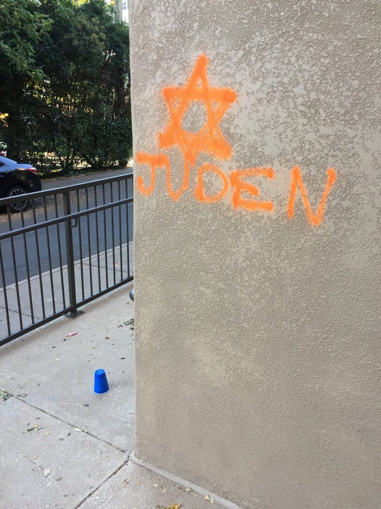 Graffiti on the side of the GrandMarc apartment building