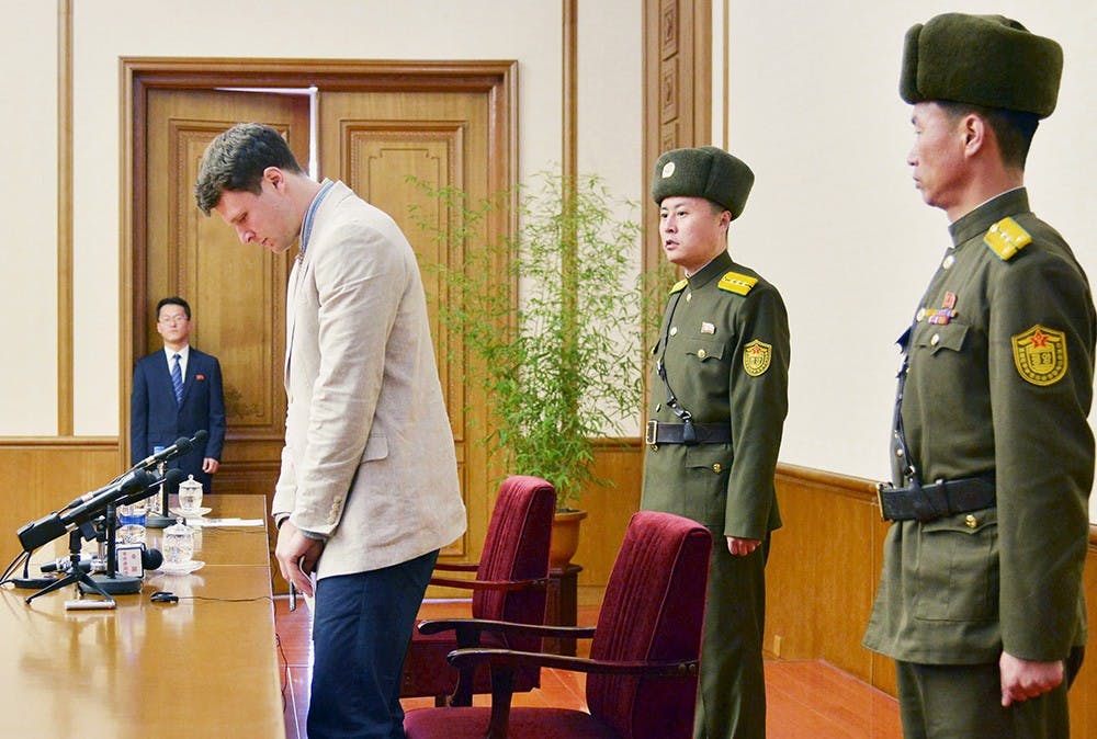 Otto Frederick Warmbier (3rd R), a University of Virginia student who has been detained in North Korea since early January, attends a news conference in Pyongyang, North Korea, in this photo released by Kyodo February 29, 2016. Warmbier was detained for trying to steal a propaganda slogan from his Pyongyang hotel and has confessed to "severe crimes" against the state, the North's official media said on Monday. Warmbier, 21, was detained before boarding his flight to China over an unspecified incident at his hotel, his tour agency told Reuters in January. Mandatory credit REUTERS/Kyodo ATTENTION EDITORS - FOR EDITORIAL USE ONLY. NOT FOR SALE FOR MARKETING OR ADVERTISING CAMPAIGNS. THIS IMAGE HAS BEEN SUPPLIED BY A THIRD PARTY. IT IS DISTRIBUTED, EXACTLY AS RECEIVED BY REUTERS, AS A SERVICE TO CLIENTS. MANDATORY CREDIT. JAPAN OUT. NO COMMERCIAL OR EDITORIAL SALES IN JAPAN. - RTS8H5V