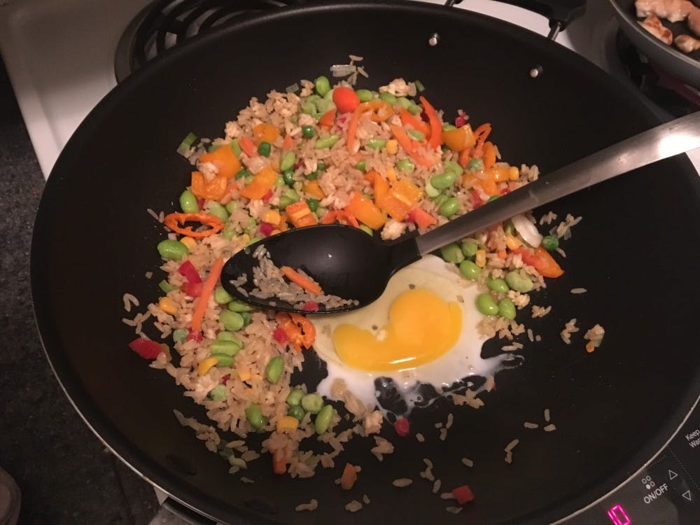 I crack the egg right into the pan, making sure to poke the yolk so the yellow insides cook, too. 