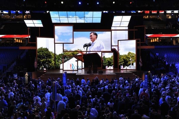 	Delegates at the Republican National Convention await Tuesday evening’s speeches in Tampa. The convention was postponed one day after Hurricane Isaac caused heavy winds in the area.