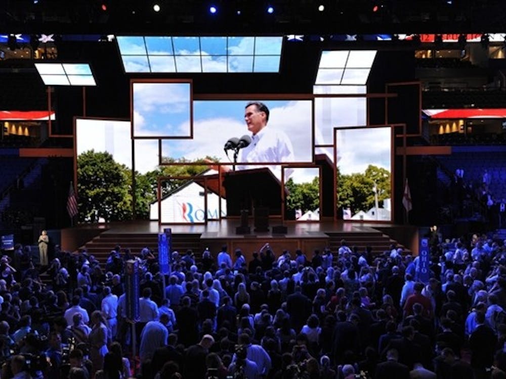 Delegates at the Republican National Convention await Tuesday evening’s speeches in Tampa. The convention was postponed one day after Hurricane Isaac caused heavy winds in the area.