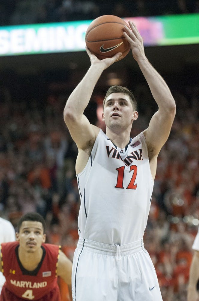 	Joe Harris, shown shooting a free throw against Maryland, will join Kyrie Irving and Andrew Wiggins in Cleveland. 