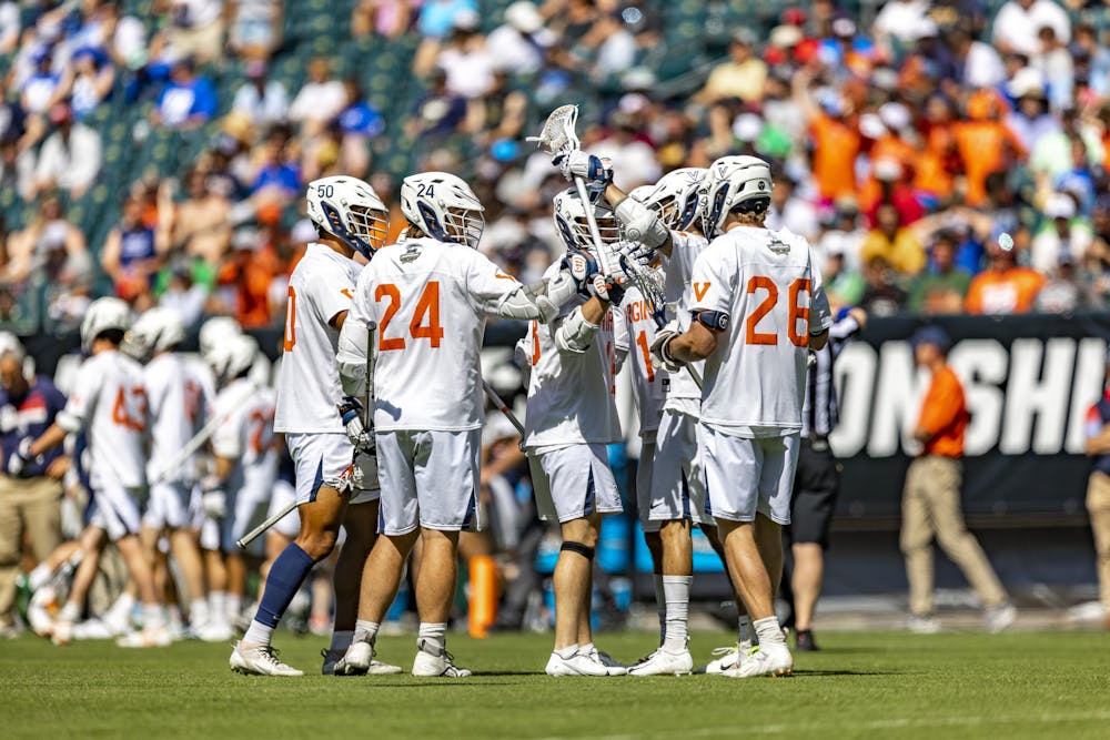 <p>A cluster of players confer after a goal.&nbsp;</p>