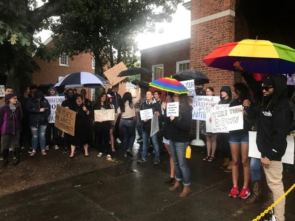 <p>Numerous community members attended the hearing with signage, despite the inclement weather.</p>