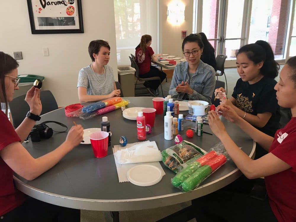 Attendees make their own Daruma dolls at Japan Club's annual Matsuri.&nbsp;