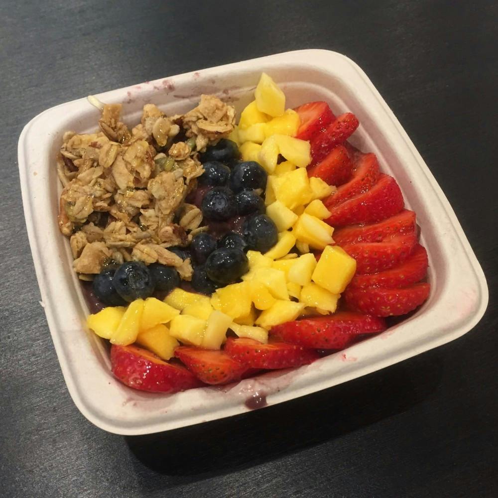 <p>I ordered the Tree Bowl, which was the blended base of acai, banana, mango and almond milk topped with blueberries, mango, strawberries and honey. I added granola.</p>