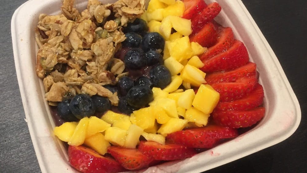 I ordered the Tree Bowl, which was the blended base of acai, banana, mango and almond milk topped with blueberries, mango, strawberries and honey. I added granola.