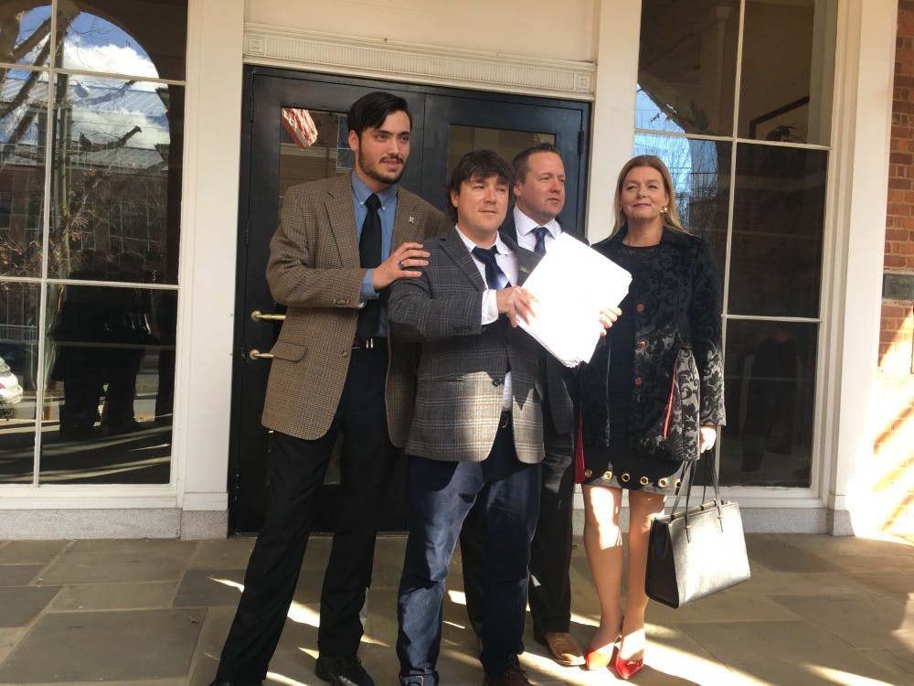 <p>From left to right:&nbsp;Isaac Smith, Jason Kessler,&nbsp;Corey Stewart and Stewart's wife, Maria Stewart, outside of Charlottesville City Circuit Court.&nbsp;</p>