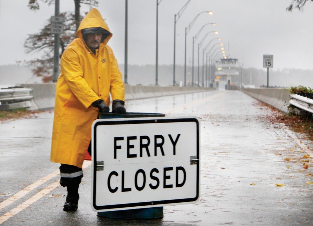 Mike Ferreira (cq), with New Horizon Security, closes the road to the Jamestown Ferry as Hurricane Sandy heads torward the eastern coast Monday, October 29, 2012.
