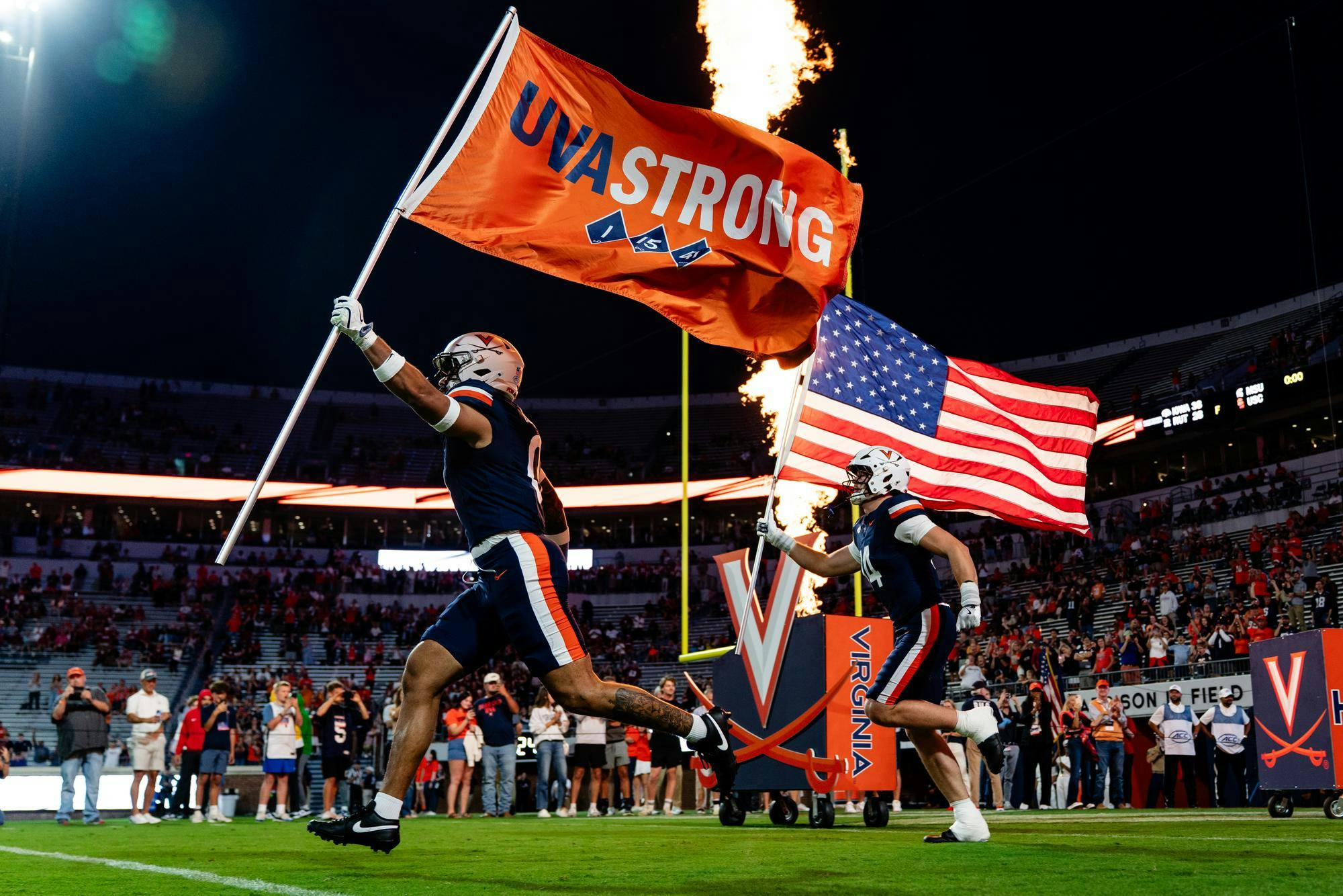 The Cavaliers take the field to a raucous ovation.