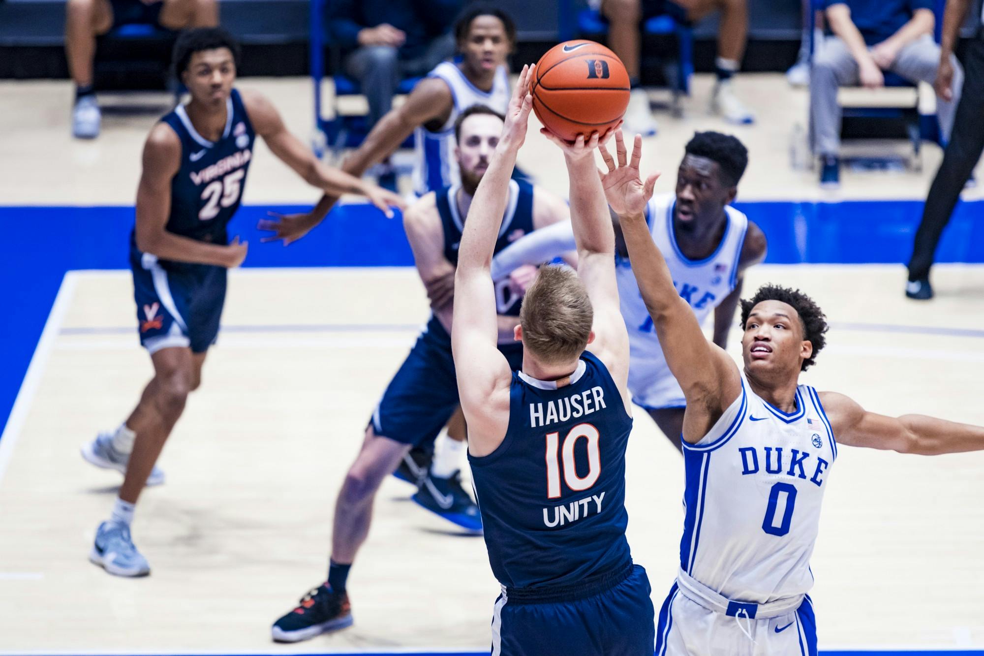 Virginia senior forward Sam Hauser shoots over Duke sophomore forward Wendell Moore.