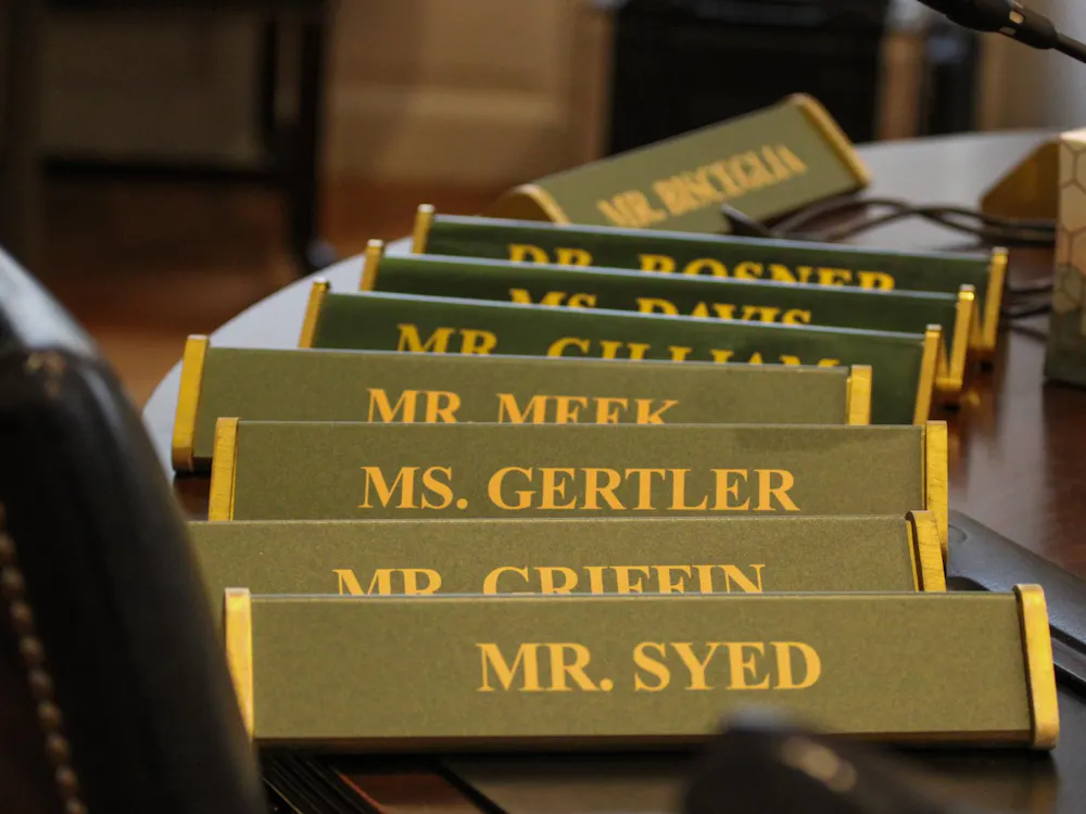 Name plaques for Board of Visitors meetings, photographed Feb. 23, 2026.