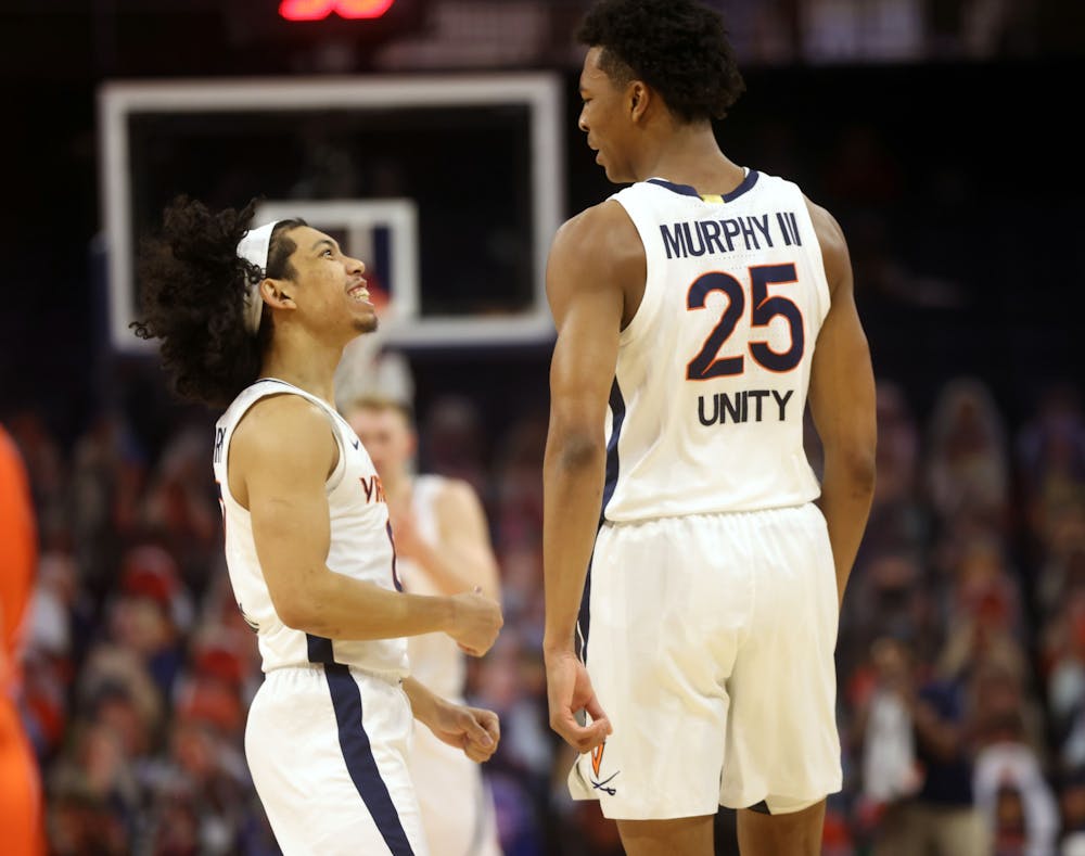 <p>Virginia junior guards Trey Murphy and Kihei Clark celebrate a play during the game</p>