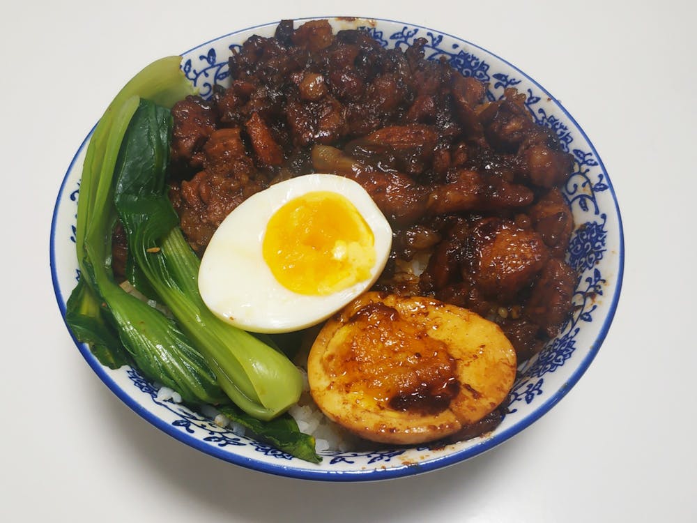 Serve the rice in a bowl, arrange the halved poached eggs and boiled bok choy and pour on the meat and gravy. Your minced pork rice is done!