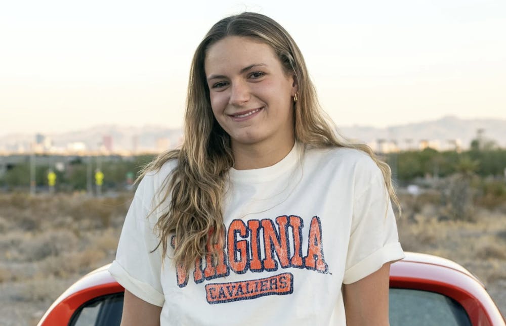 <p>Grimes poses in a Virginia shirt for her announcement.</p>