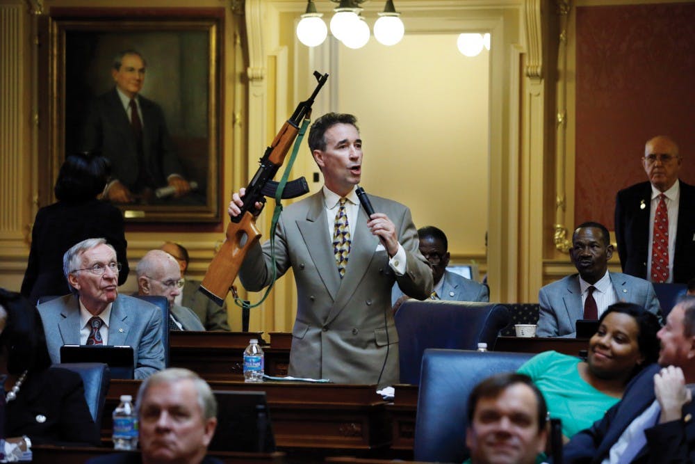 Del. Joe Morrissey, D-Henrico, holds up an AK47-style rifle as he speaks for more control on such weapons during a floor speech to the Virginia House of Delegates at the State Capitol in Richmond, VA Thursday, Jan. 17, 2013. ORG XMIT: RIC1301171258484610