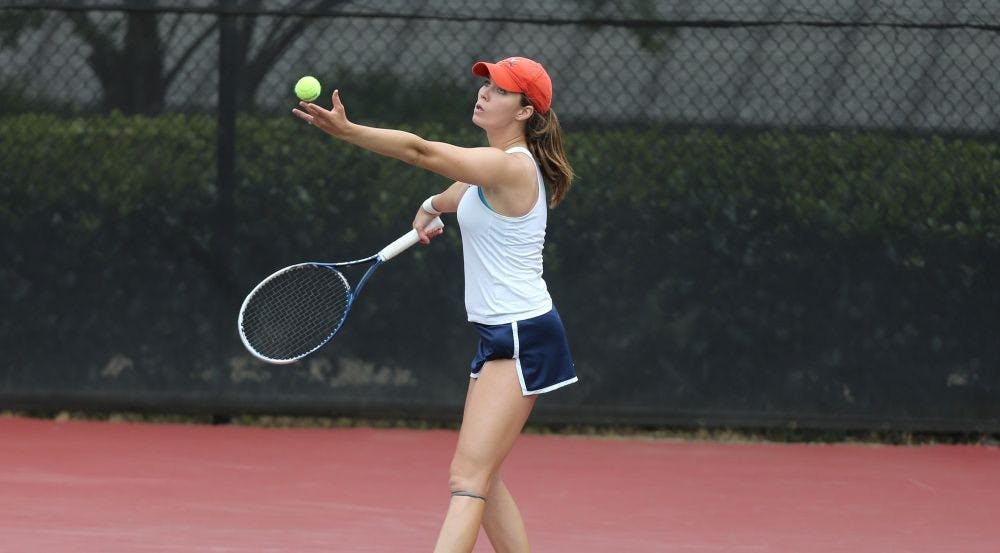 <p>Collins prepares to serve during a 2014 sophomore campaign that would lead to the first of her two NCAA singles titles.</p>