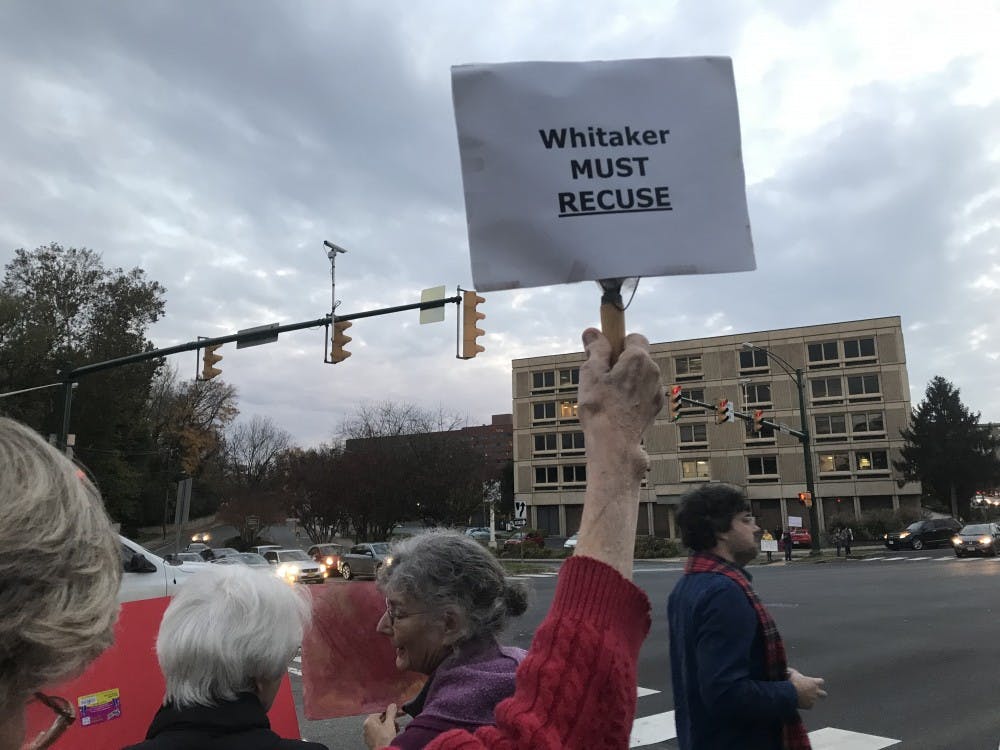 Hundreds of protesters gathered along the sidewalk in front of the Albemarle County Office Building, many holding signs expressing their opposition to appointment of Matthew Whitaker of Acting Attorney General.