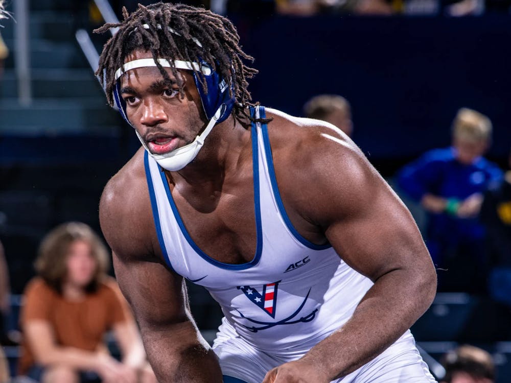 Virginia won the first three weight classes and held the lead through nine bouts, but a late pin swung the momentum and ultimately decided the dual.