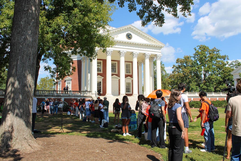 Dozens of protesters wait in line to enter the full Board of Visitors meeting — which reached capacity — Sept. 12, 2025.