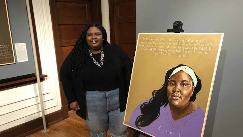 &nbsp;Zyahna Bryant unveiled artist Robert Shetterly’s portrait of her during the event and read the inscription: “...I wrote the petition… calling for the removal of the Robert E. Lee statue and the renaming on the park, formerly known as Lee Park. I was 15.” The portrait hangs beside Shetterly’s painting of Sojourner Truth. &nbsp;