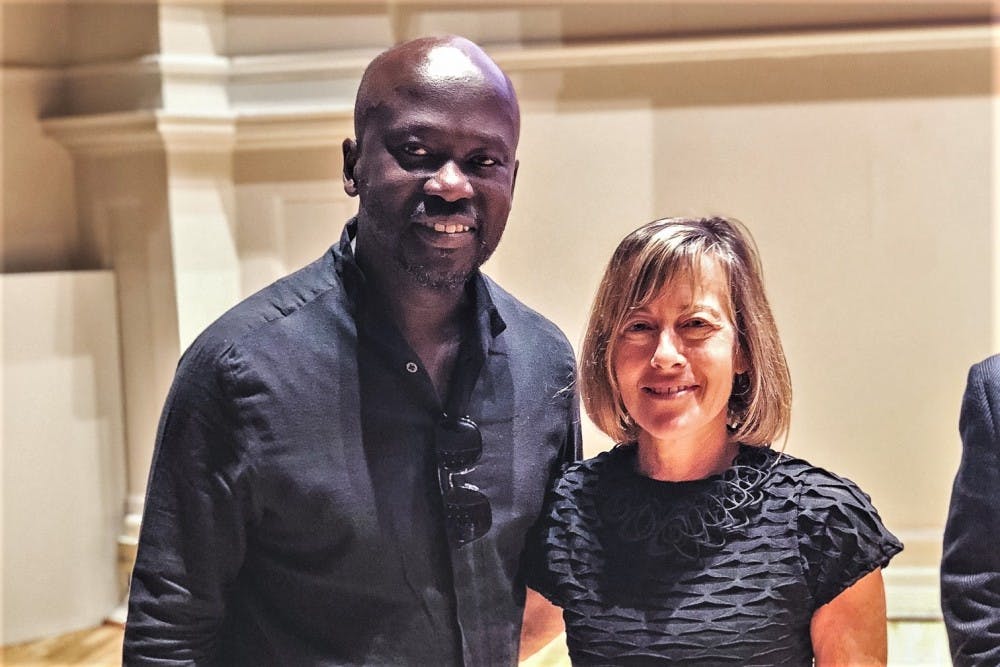 Sir David Adjaye poses with Ila Berman, dean of the School of Architecture.