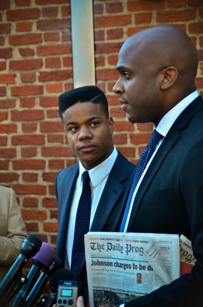 Martese Johnson, left, will continue to engage the services of attorney Daniel Watkins, right, as he pursues a civil suit against Virginia ABC. 