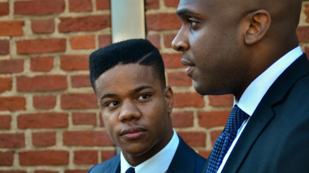 Martese Johnson, left, will continue to engage the services of attorney Daniel Watkins, right, as he pursues a civil suit against Virginia ABC. 