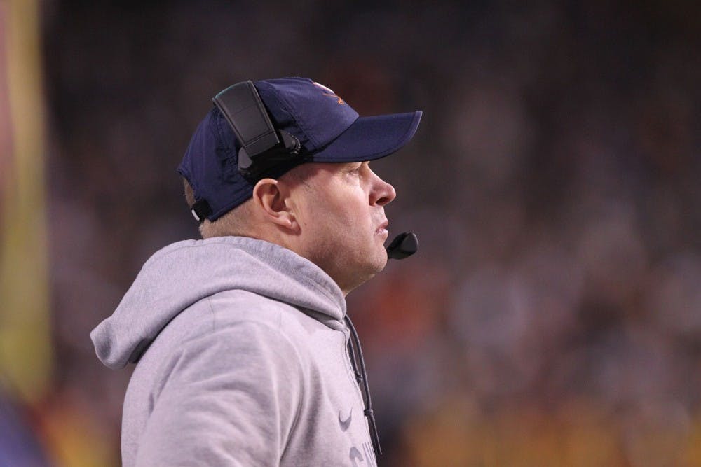 Virginia Coach Bronco Mendenhall led the Cavaliers to four more wins this year than in his first season with the team.