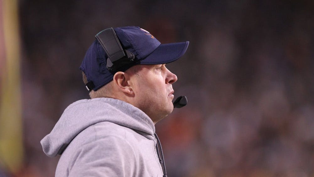 Virginia Coach Bronco Mendenhall led the Cavaliers to four more wins this year than in his first season with the team.