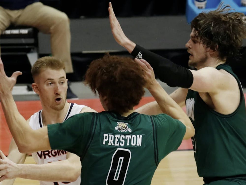 Sam Hauser looks frantically for a way to escape a double team.